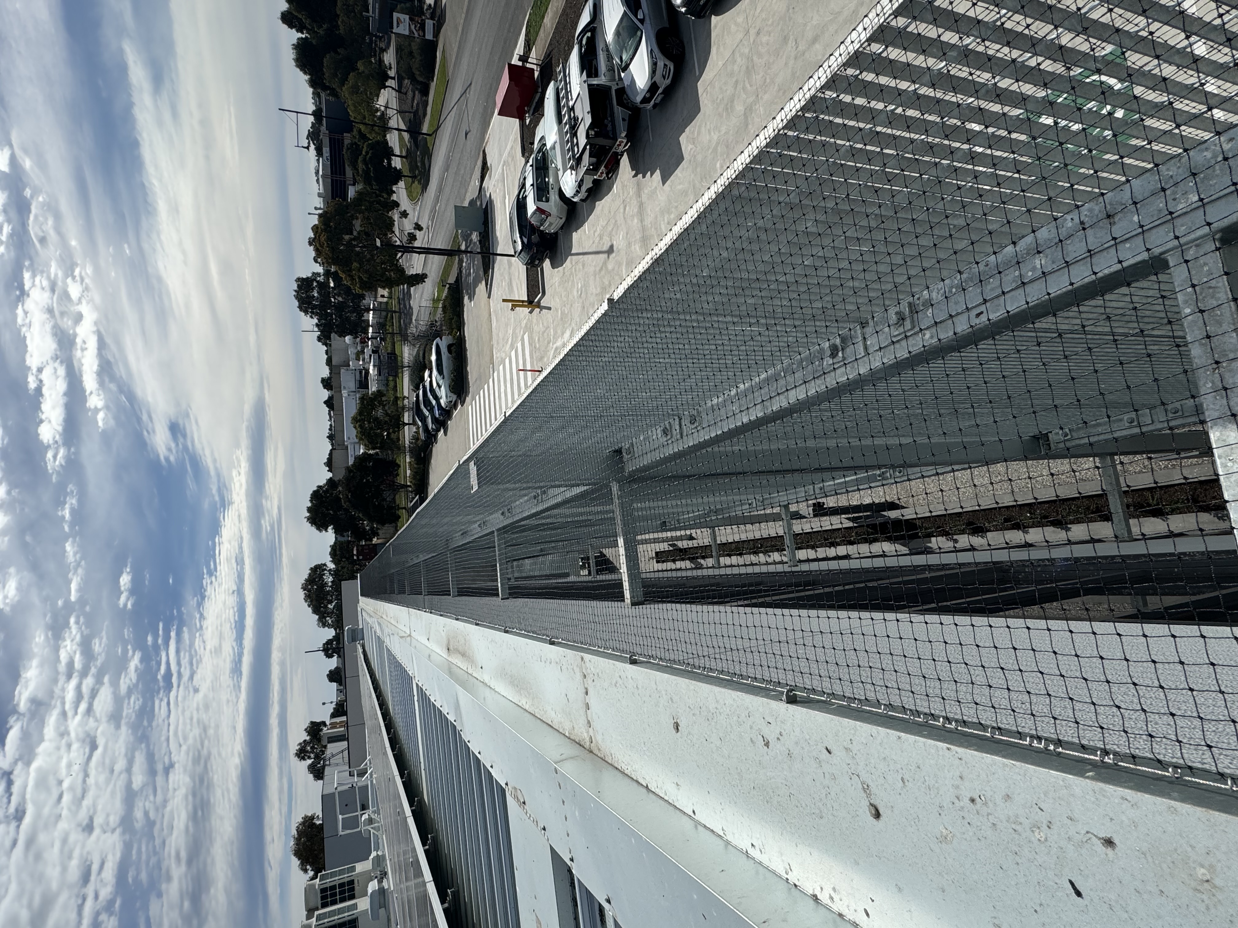 melbourne based construction with steel gratings covered by netting